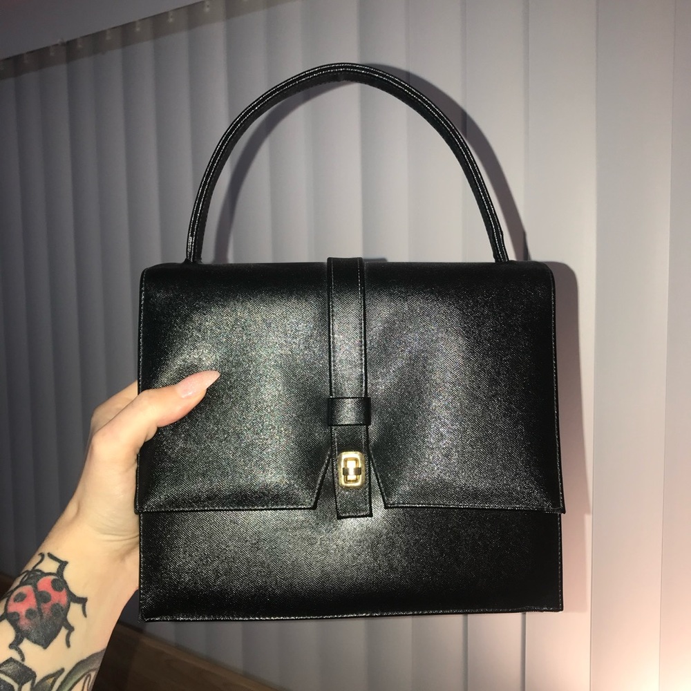 Vintage black structured purse with gold clasp. Good condition